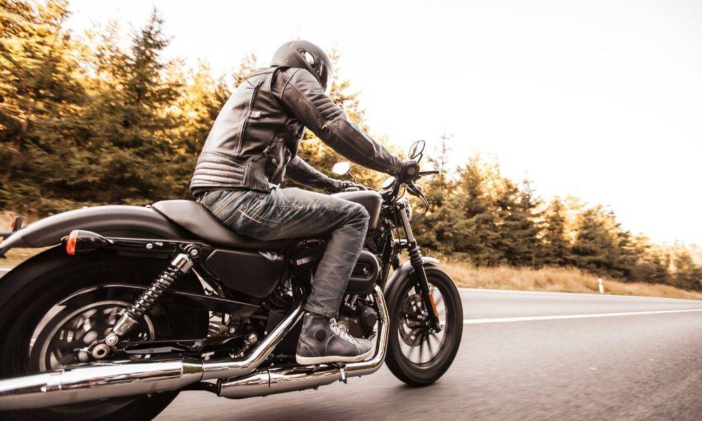 A man riding a motorcycle.